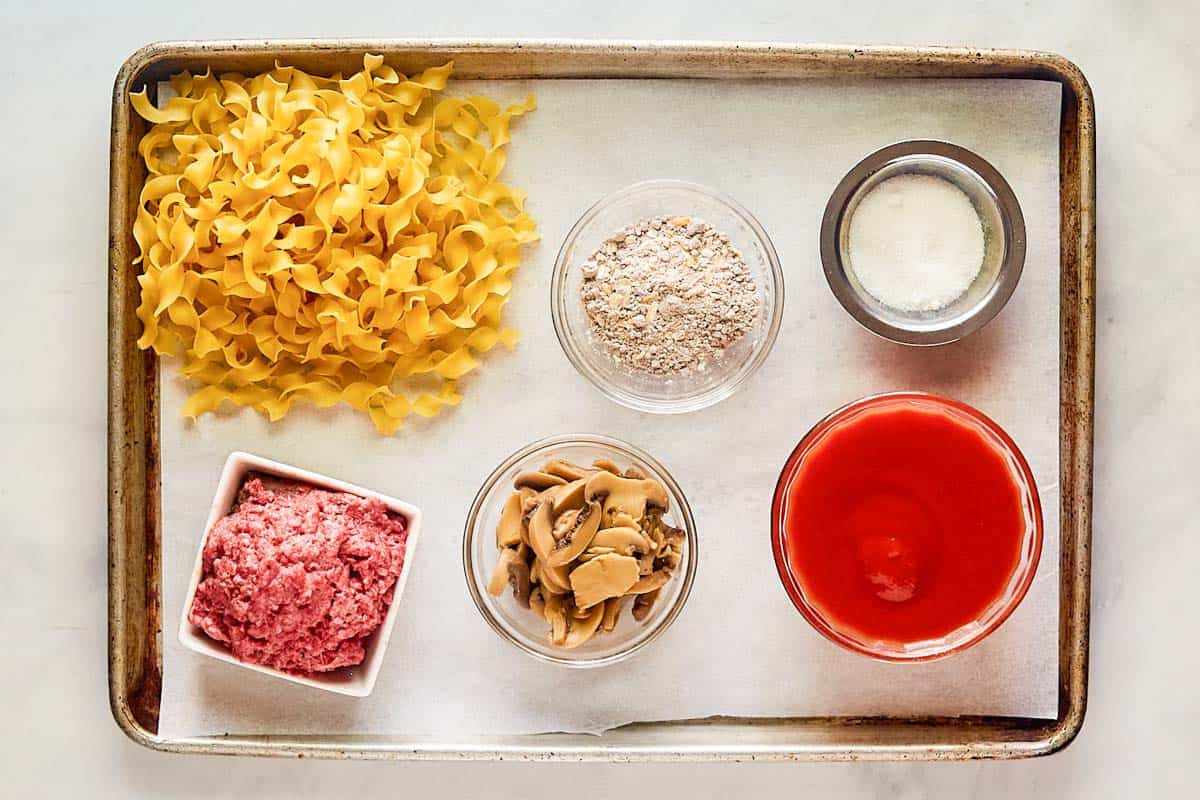 Beef goulash ingredients on a tray.
