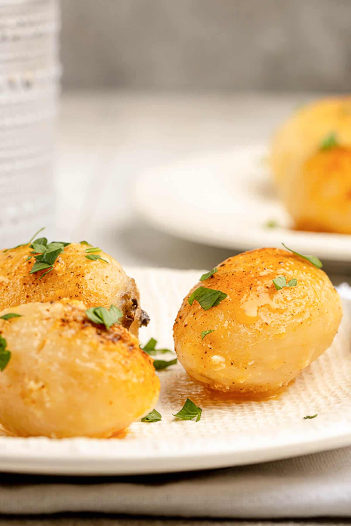 Golden potatoes on plates.