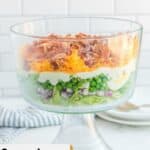Classic seven layer salad in a trifle dish.