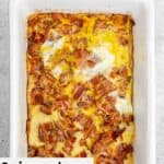 Swiss and bacon squares in a baking dish.