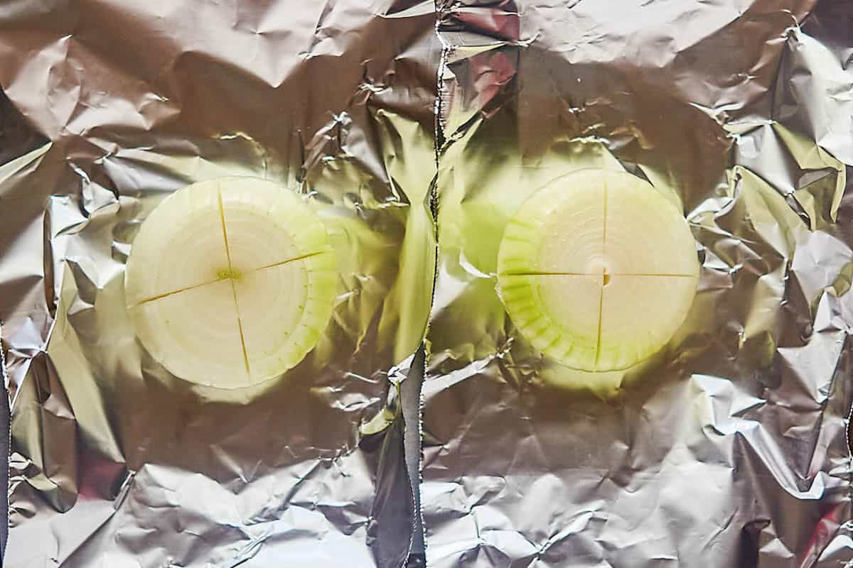 Cut sweet onions on foil.