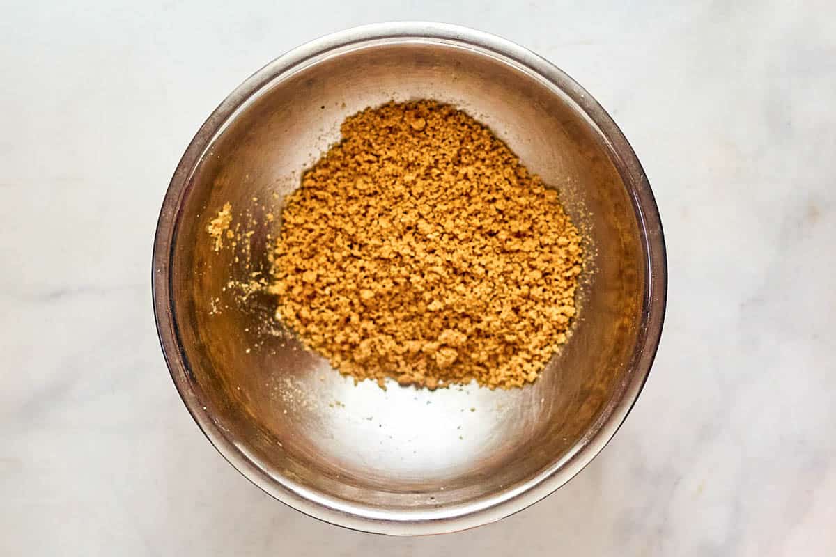 Buttered bread crumbs for scalloped cabbage in a mixing bowl.