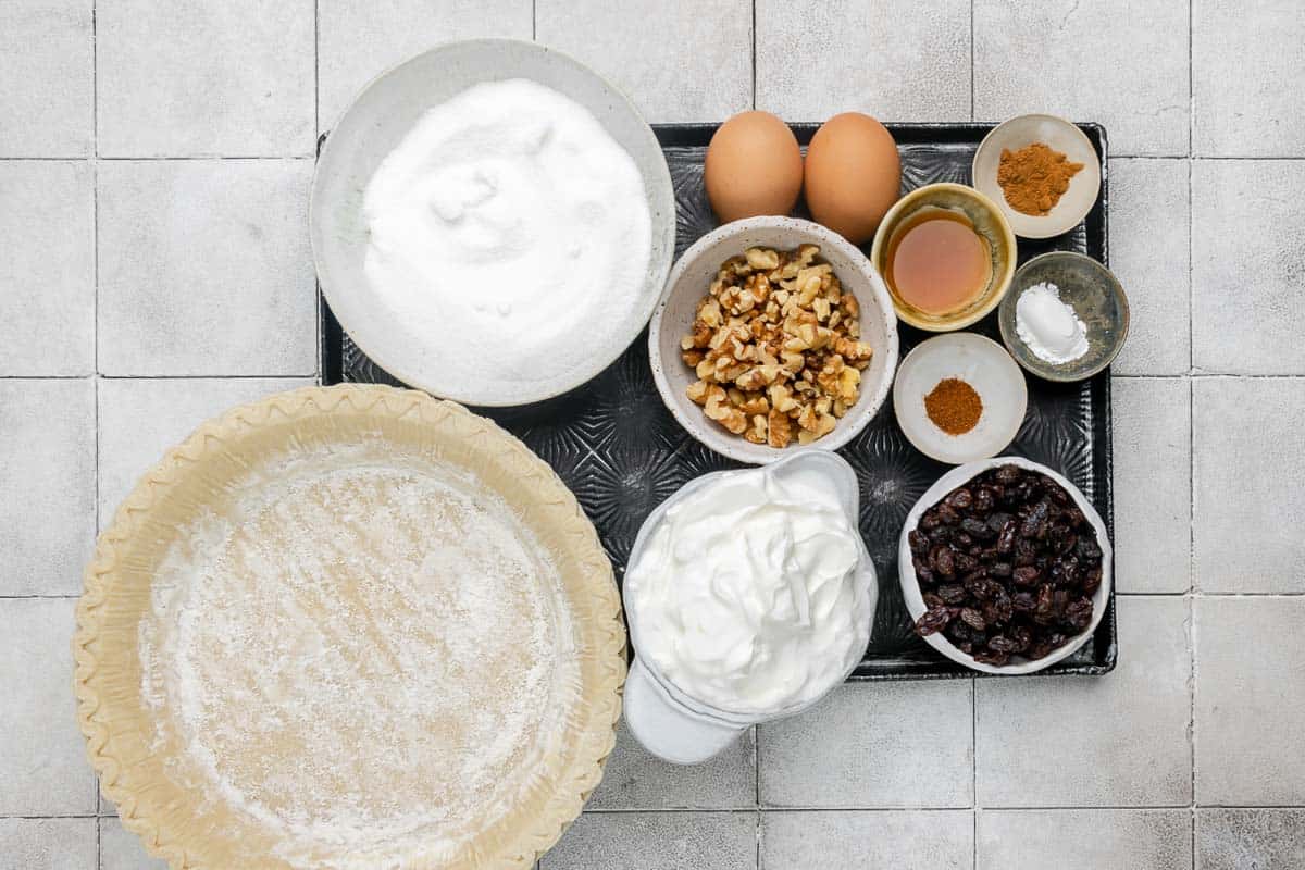 Sour cream raisin pie ingredients on a tray.