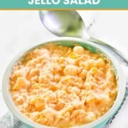 Orange Jello cottage cheese salad in a bowl.