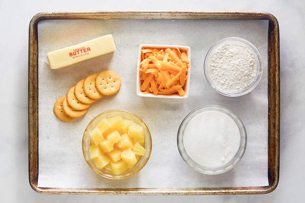 Pineapple cheese casserole ingredients on a tray.