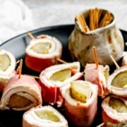 A platter of ham and pickle roll ups.