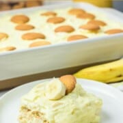 Sour cream banana pudding on a plate and in a casserole dish.