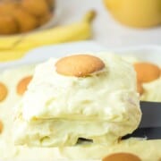 Sour cream banana pudding serving on a spatula.