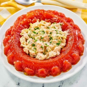 Tomato aspic ring with shrimp salad served in the center.
